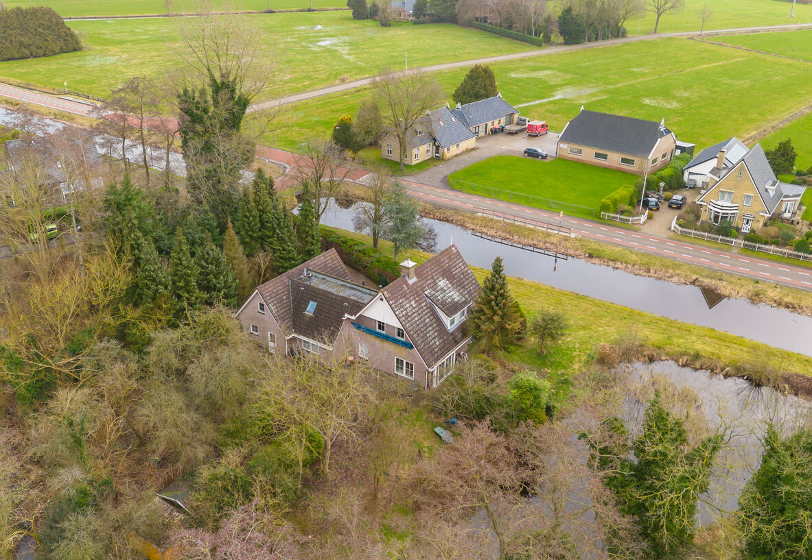 Aerial view, house beside the canal